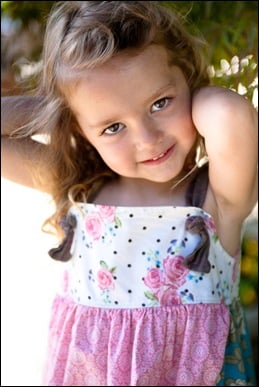 child posing for photograph at brookside gardens in maryland