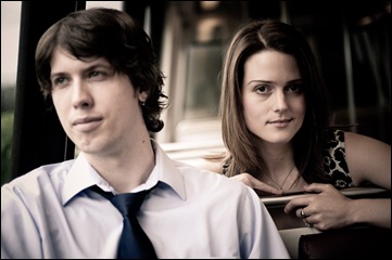 man and woman sitting in metro car