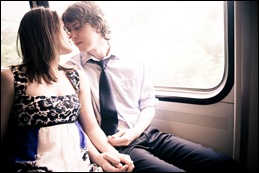 couple being affectionate on dc metro car