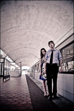couple standing by dc metro car