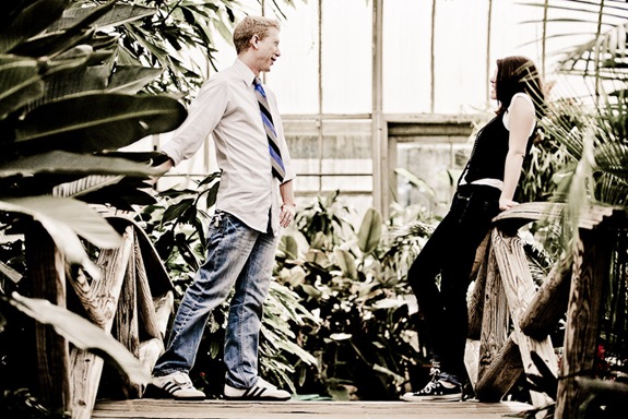 man and woman standing on foot bridge in conservatory at Brookside Gardens in Wheaton MD