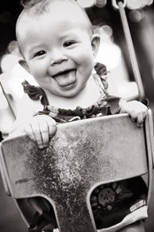baby laughing on swings at allens pond in bowie md