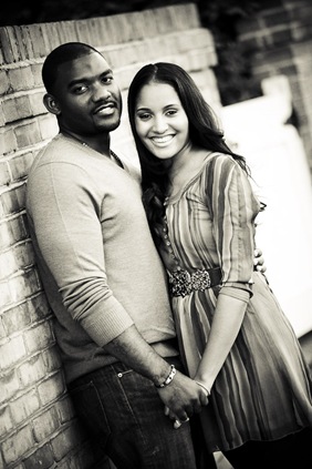 man and woman standing together in old town alexandria