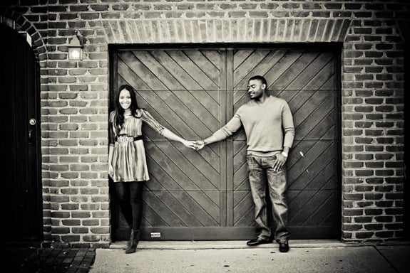 man and woman in front of garage in old town alexandria