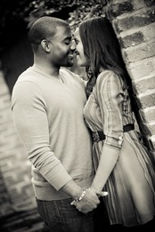 man and woman kissing in old town alexandria