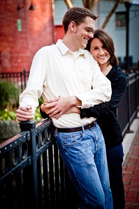 man and woman in Ellicott City leaning on rail