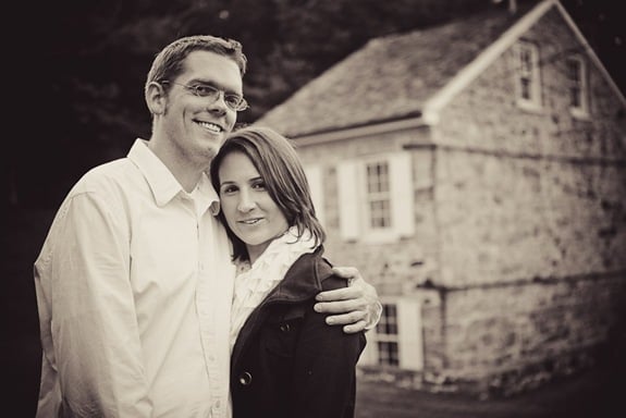 man and woman in Ellicott City in front of old building