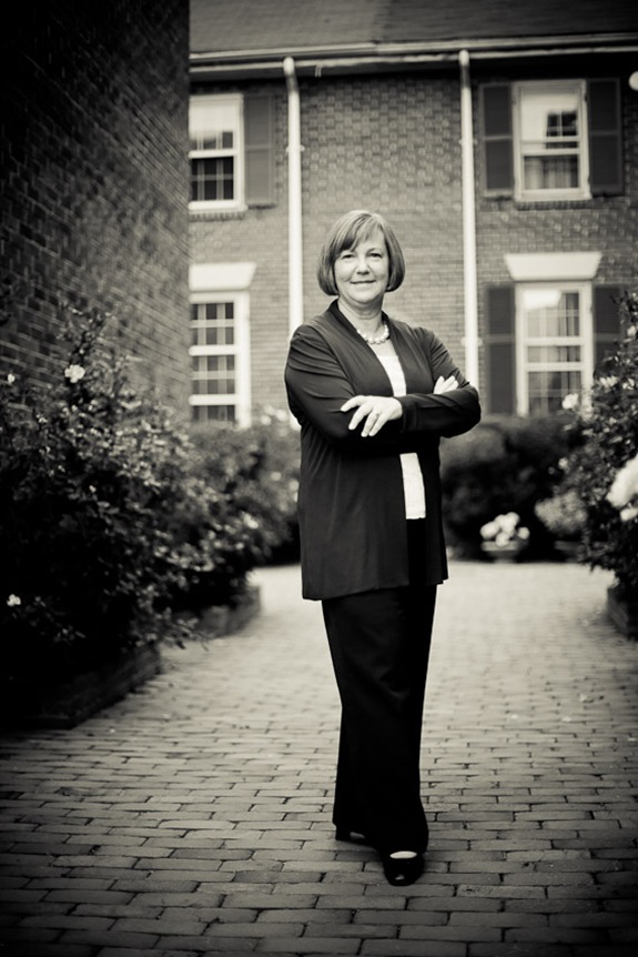 Eileen Kugler standing in walkway for business portrait in downtown alexandria va