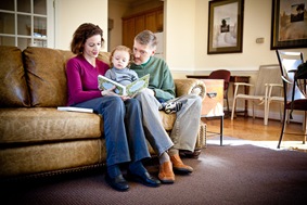 Family reading a book together