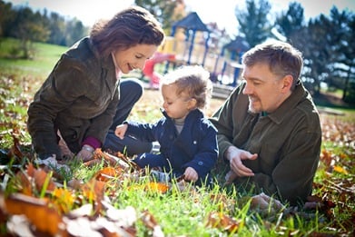 Family sitting in grass in Derwood Maryland