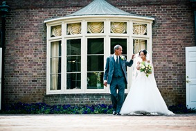 bride walking down isle  at the Newton White Mansion in Mitchellville MD