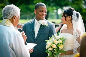 bride and groom on alter  at the Newton White Mansion in Mitchellville MD