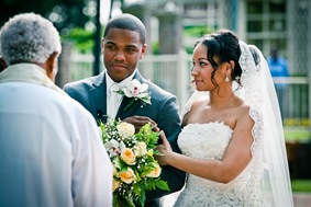 bride and groom at alter  at the Newton White Mansion in Mitchellville MD