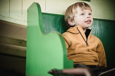boy sitting in train car at Baltimore & Ohio Railroad Museum