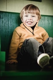 boy sitting in train car at Baltimore & Ohio Railroad Museum