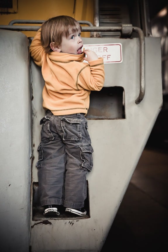 boy climbing on locomotive at Baltimore & Ohio Railroad Museum