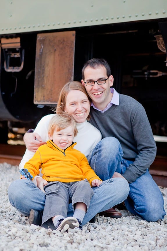 family sitting in front of train at Baltimore & Ohio Railroad Museum