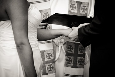 groom placing ring on brides finger at Mt. Airy Mansion in Upper Marlboro Maryland