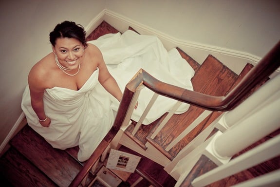 bride on stairs at Mt. Airy Mansion in Upper Marlboro Maryland