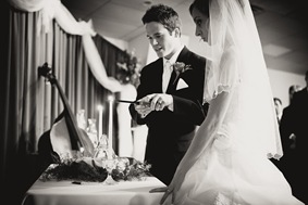 Bride and groom lighting unity candle in Mechanicsville MD