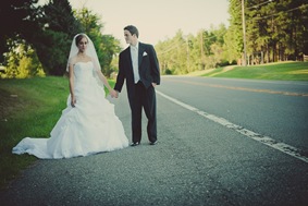 Bride and groom standing by road in mechanicsville md