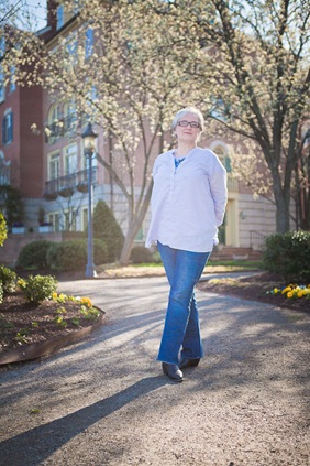wide shot of woman standing in old town alexandria