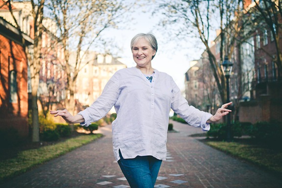 woman standing and smiling in old town alexandria