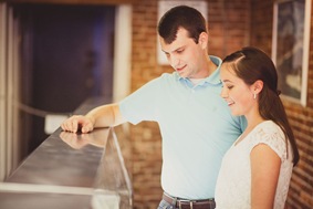 Engaged couple buying ice cream and coffee on a date