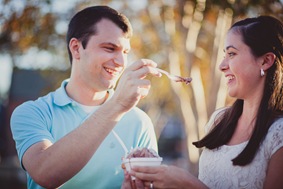 Engaged couple buying ice cream and coffee on a date