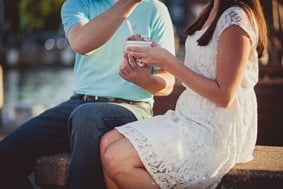 Engaged couple buying ice cream and coffee on a date