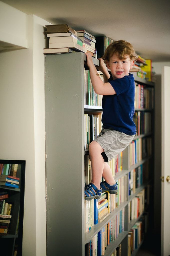 kid-climbing-bookcase