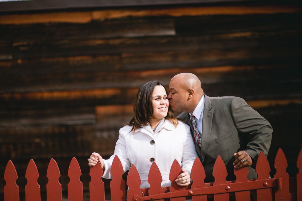 couple-next-to-picked-fence