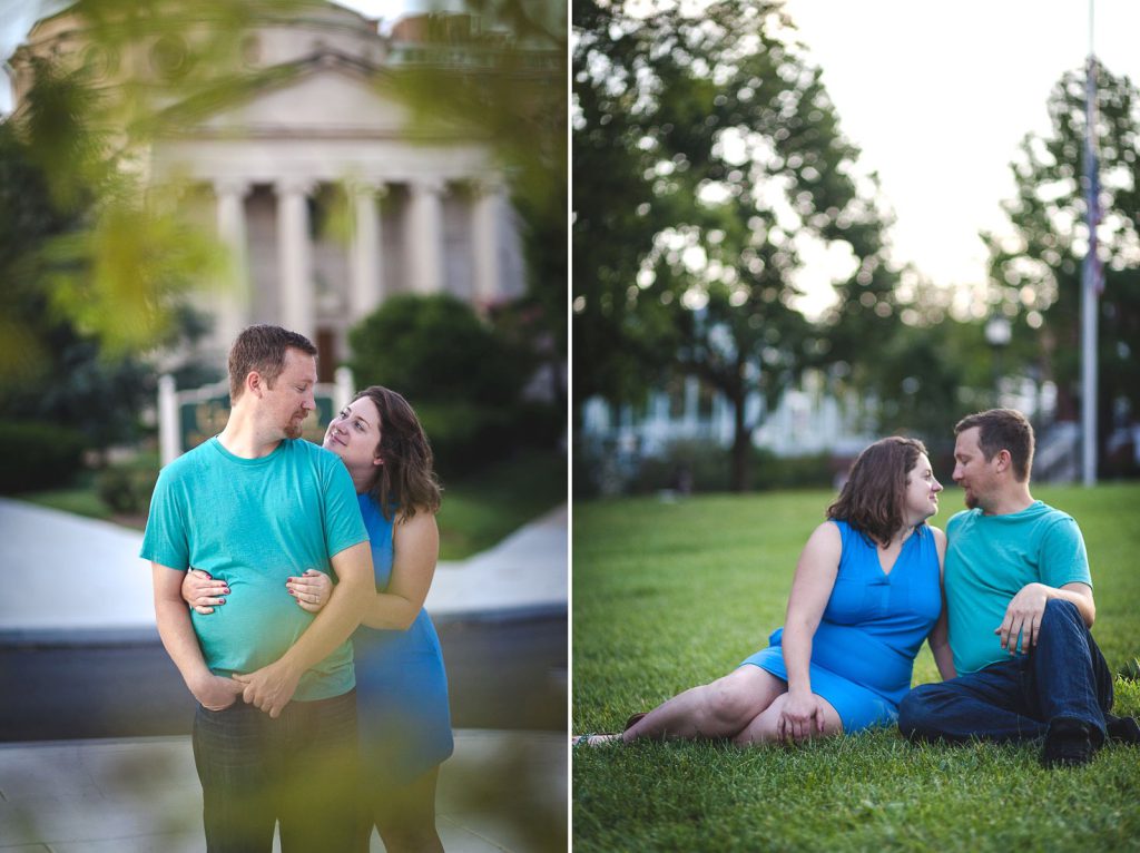 A couple sits on the grass in front of the capitol building.