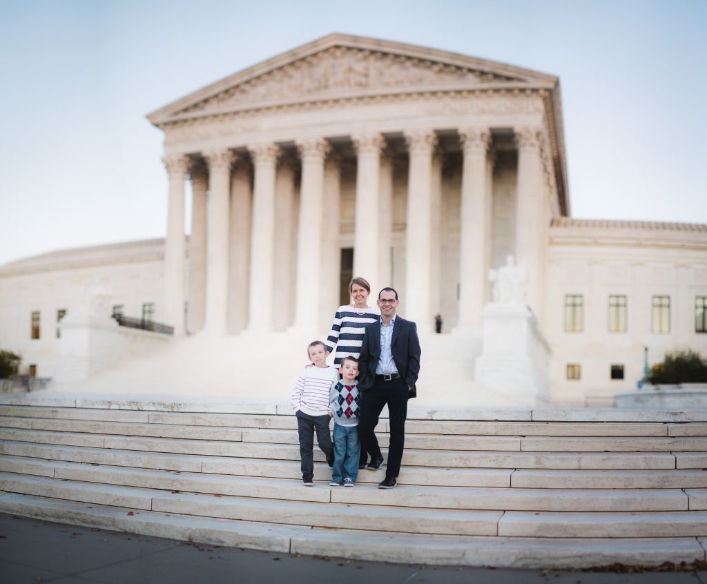 A family portrait in front of the supreme court building.