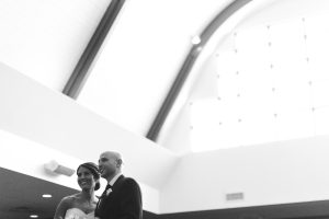 A bride and groom standing in front of a church for their Annapolis Wedding Photography.
