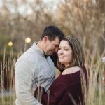 A couple embraces during their quiet waters park engagement session.