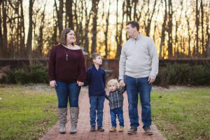 A family enjoys a peaceful evening at Quiet Waters Park during their engagement session.