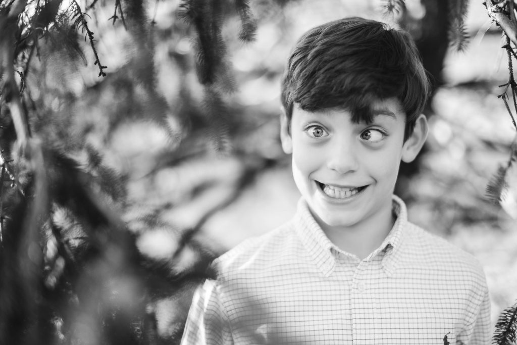 A black and white portrait of a boy in Federal Hill Park.
