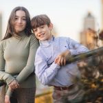 A boy and a girl posing for portraits in Federal Hill Park.