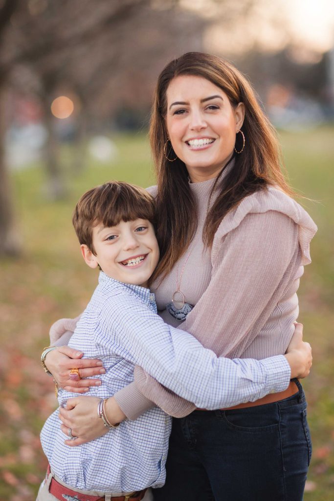 A family embracing in a park.