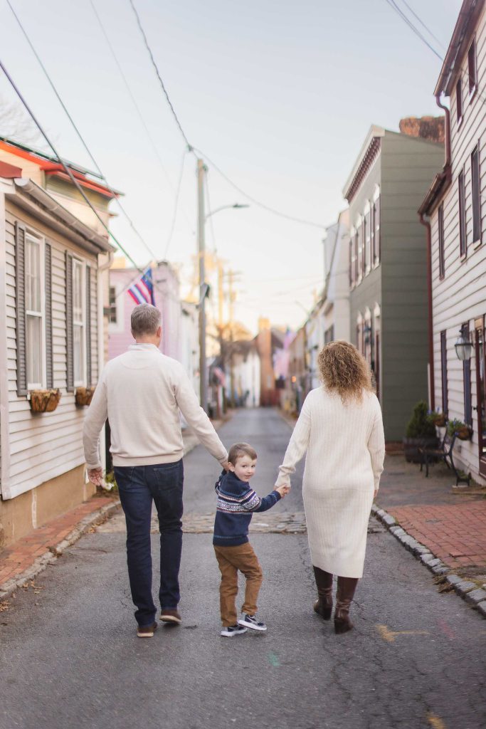 A family walks down a downtown street in Annapolis, creating a picturesque portrait of small-town life.