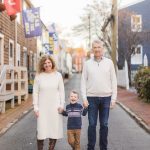 A family strolls through downtown Annapolis with their son.