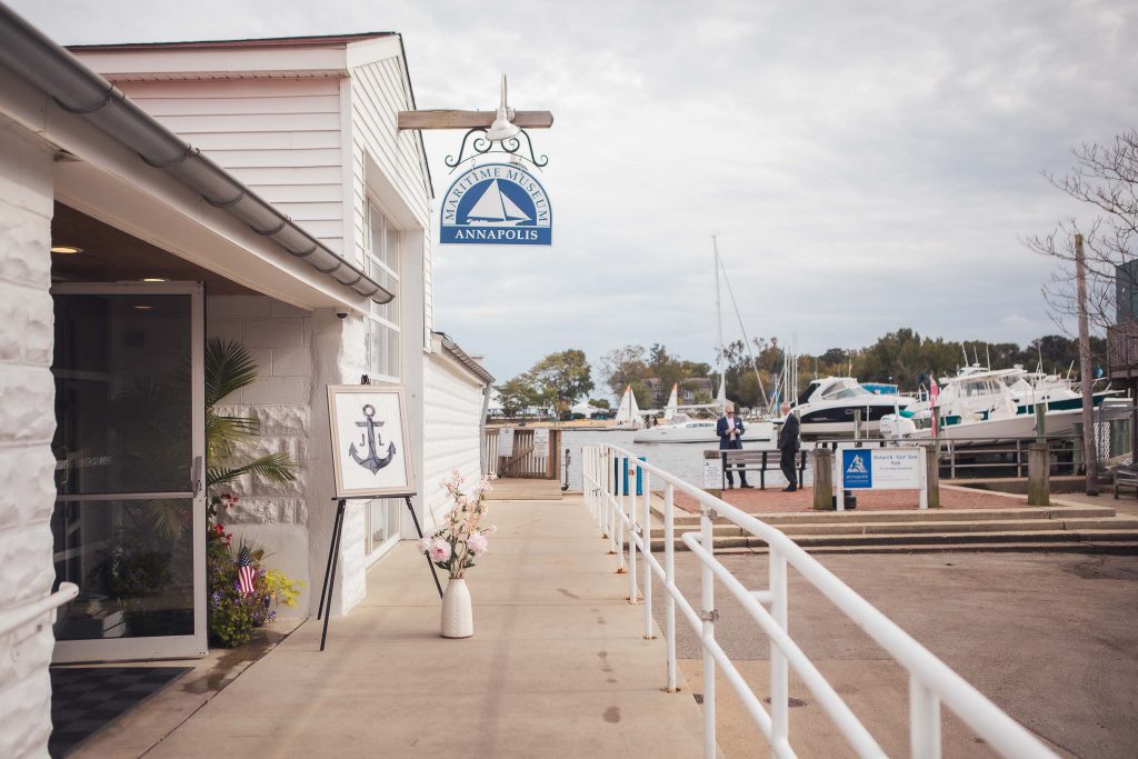 The marina entrance in Annapolis, Maryland with a boat docked in front of it.
