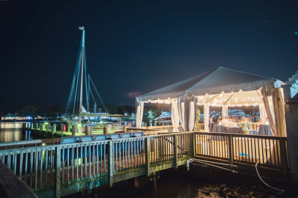 A tent is set up on a dock at Annapolis Maritime Museum.