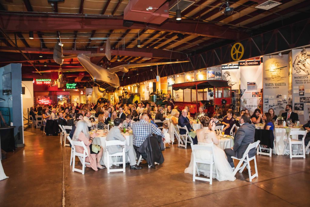 A wedding reception in a large room at the Baltimore Museum of Industry in Maryland.