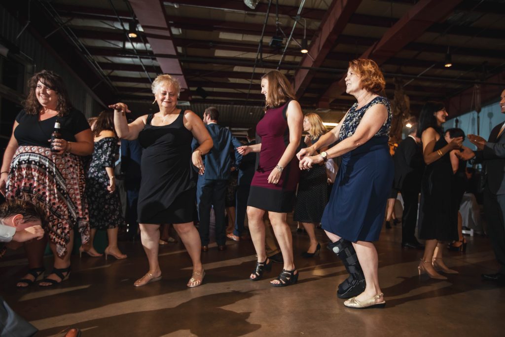 A group of people dancing at the Baltimore Museum of Industry in Maryland.