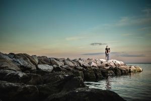 A man standing on a rock in the water at Beverly Triton Nature Park, Maryland.