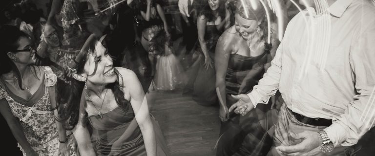 A black and white photo of people dancing at a wedding in Bowie, Maryland.