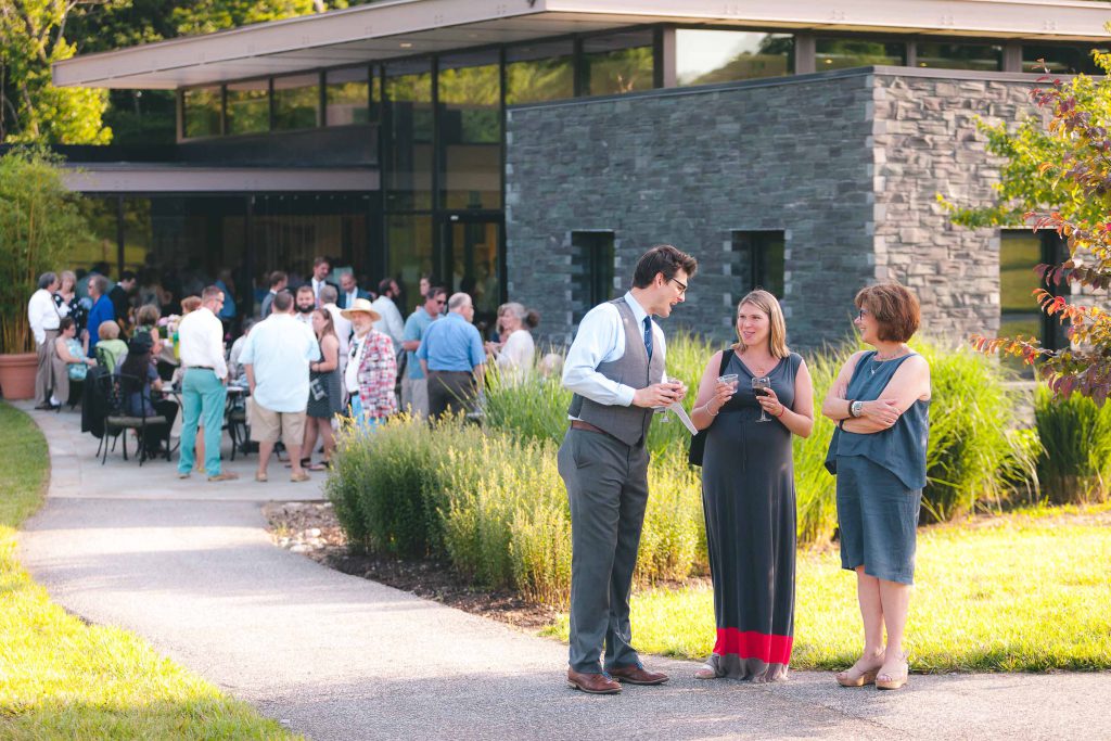 A group of people standing in front of the Cylburn Arboretum in Baltimore, Maryland.