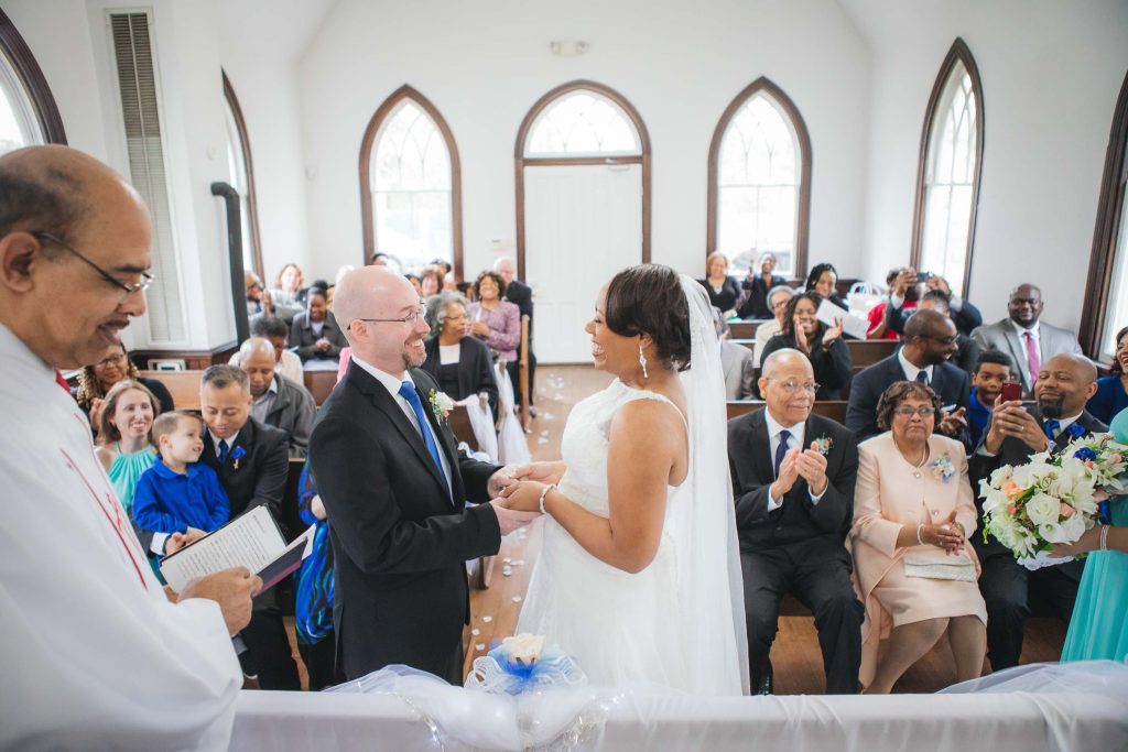 A bride and groom exchange their vows in the Glenn Dale church.